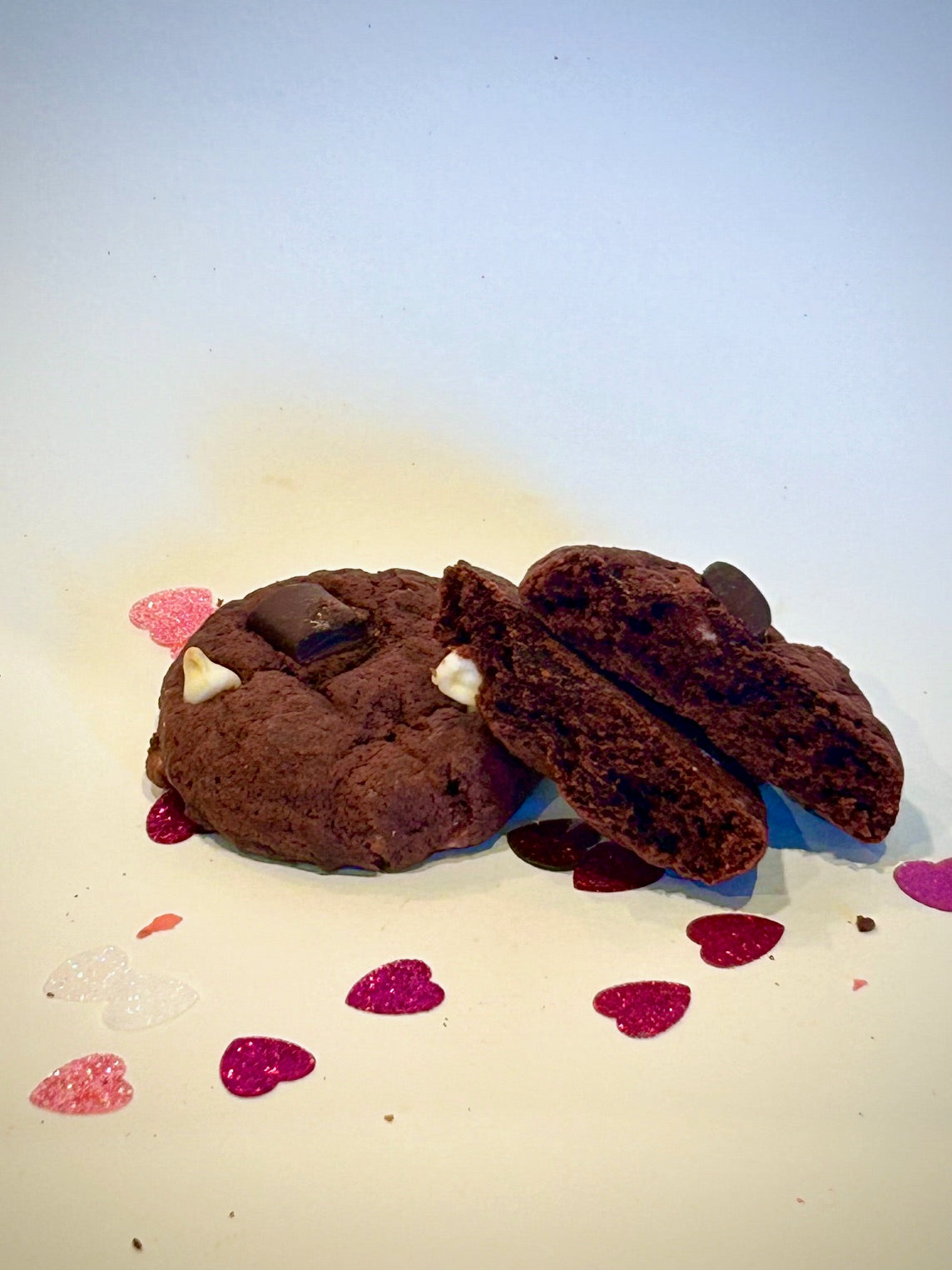 Red Velvet Cookie. Light chocolate flavor complimented with white chocolate chips and chocolate chunks. This cookie is soft and chewy 